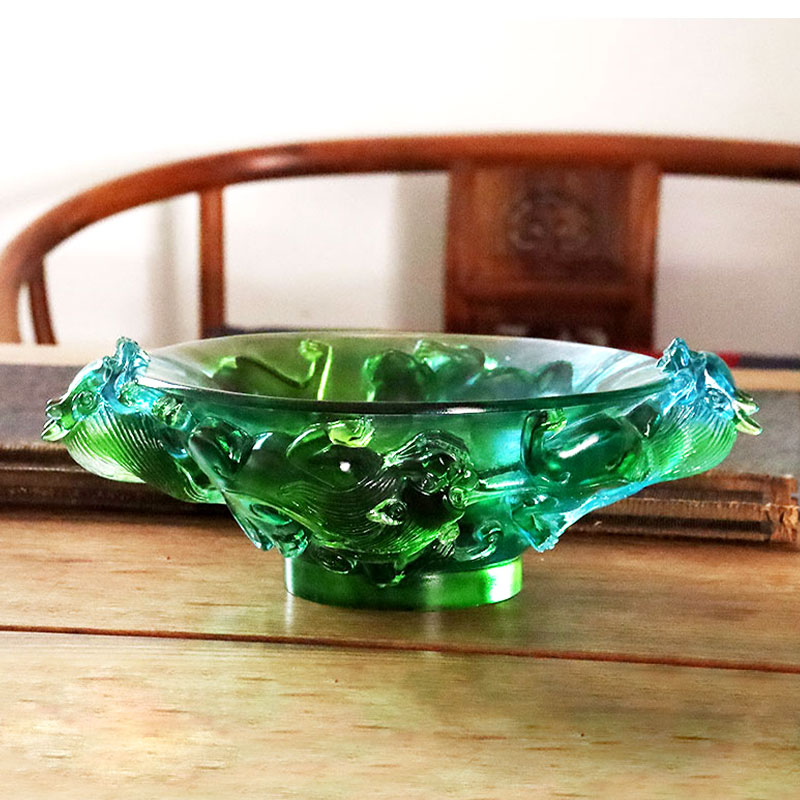 Gjennomsiktig grønn fruktfat i glass