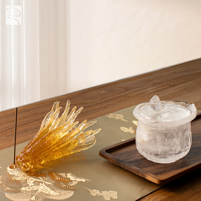 Håndformet røkelsesholder i gyldent glass