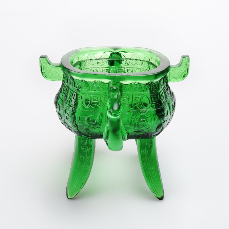 Smaragdgrønt stativ i krystallglass med øreformede håndtak