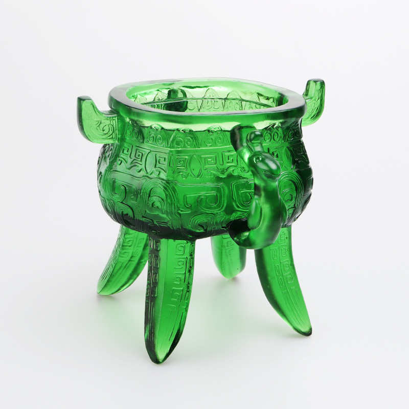 Smaragdgrønt stativ i krystallglass med øreformede håndtak