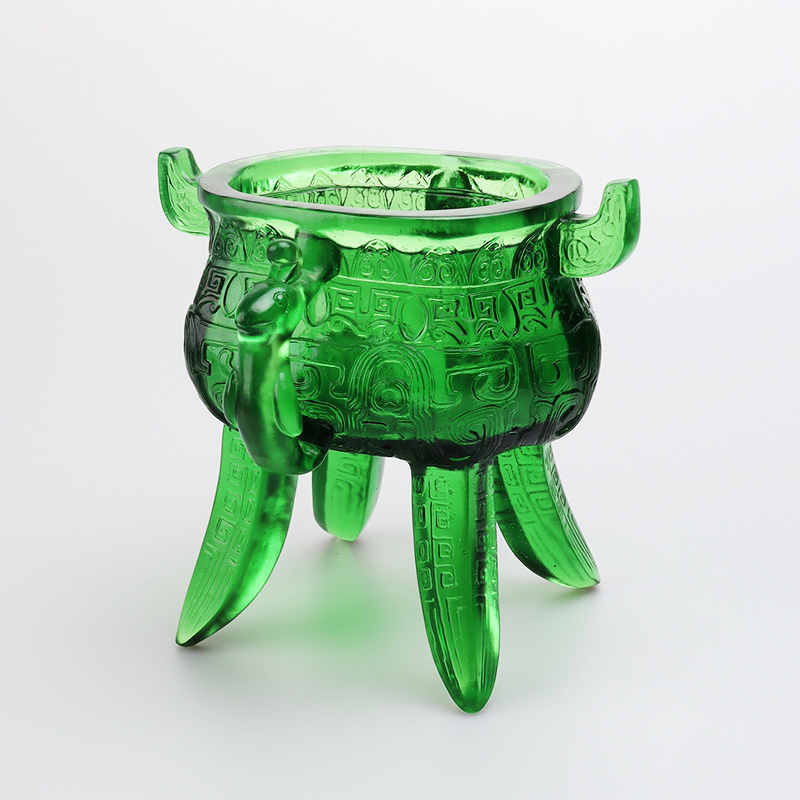 Smaragdgrønt stativ i krystallglass med øreformede håndtak